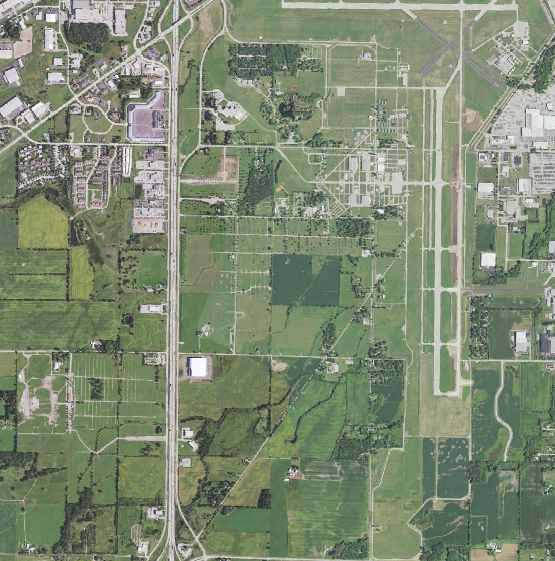 Aerial view of Wittman Regional Airport and the fields and roads south and west of it in Oshkosh