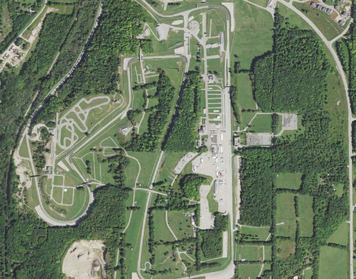 Aerial view of the Road America circuit's front straight, paddock and infield
